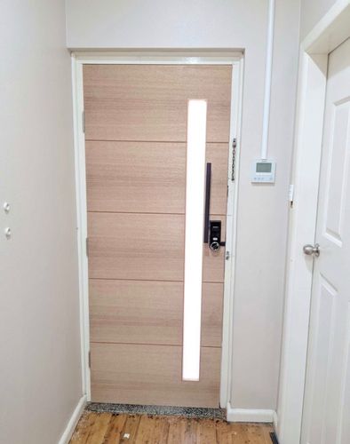 White bi-fold doors with dark hardware